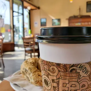 a cup of coffee and a plate of donuts