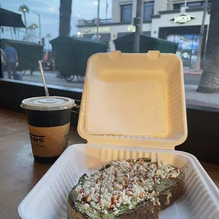 Avocado toast with feta cheese and hot sauce. Washed it down with a refreshing cold nitro coffee. Delicious!