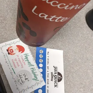 a cup of coffee and a ticket