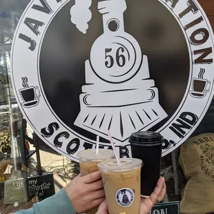 a person holding a cup of coffee