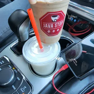 a hand holding a cup of coffee