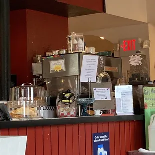 a coffee shop counter with coffee machines