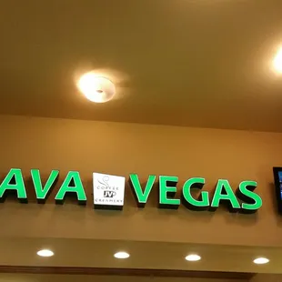a neon sign above the entrance