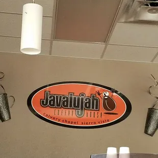 coffee cups hanging from the ceiling