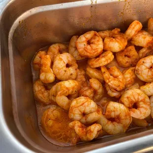 a pan of cooked shrimp