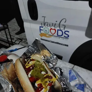 a hot dog with ketchup and mustard