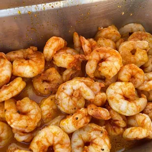 a pan of cooked shrimp