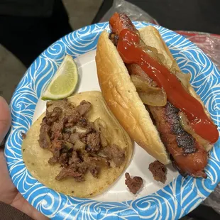 Asada taco and a bacon wrapped hotdog which were both amazing