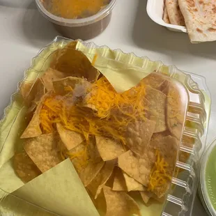 The chips they give you with guac and chips. Why isn't the cheese melted? Lol