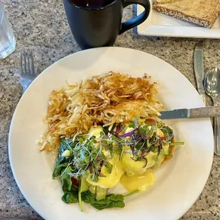 Mt. Hood Benedict (avocado, tomato and spinach) with crispy hash browns
