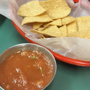 Home salsa and warm chips for waiting.