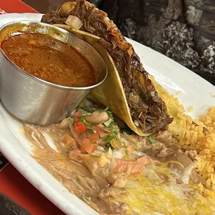 Tacos birria. That taco is LOADED of meat!! Omg it's a plate to repeat and repeat!!