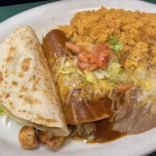 Two choice: - Shredded Beef Enchilada - Grilled Chicken Quesadilla  Rice and Beans included (taco salad may be available)  COOL COMBINATION.