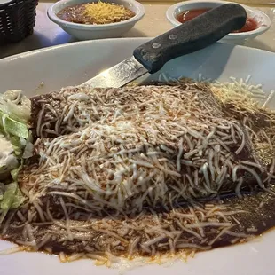 Al pastor enchilada with mole sauce