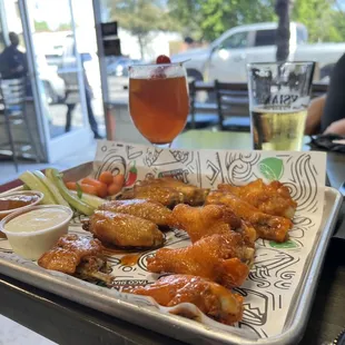 Wings, half spicy Asian , half buffalo. Spicy white claw.