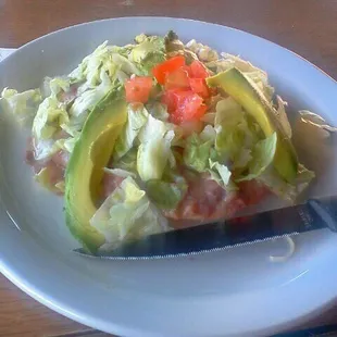 Tosada a la carte . Bean, lettuce,tomato, and avacado:)