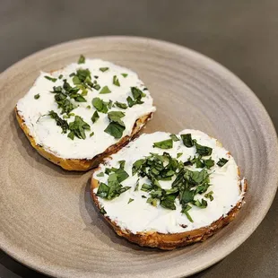 Jalapeño cheddar bagel with cream cheese and fresh basil. The bagel is yummy