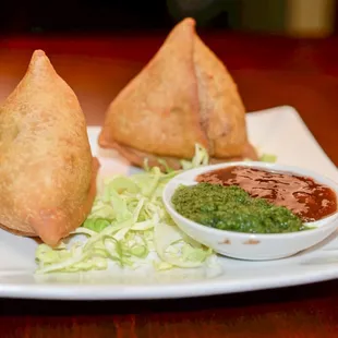 a plate of saman and a bowl of dip