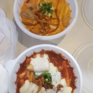 two bowls of food on a table