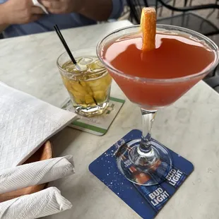 two cocktails on a table