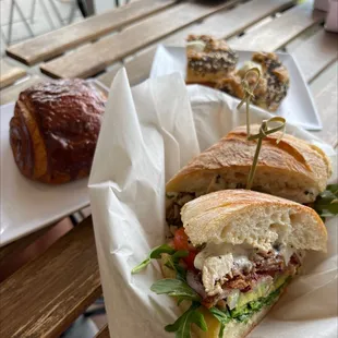 Chicken bacon avocado on ciabatta, pain au chocolat, everything Asiago bagel with cream cheese