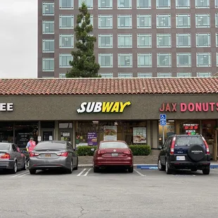 cars parked in front of the store
