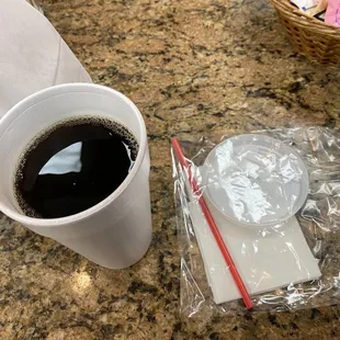 a cup of coffee and a napkin