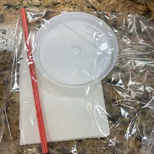 They nicely wrap your stir stick, napkin, and top separately.