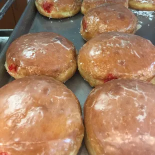 Jelly-filled donuts.  A bit of a rustic look about them.