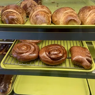 Chocolate long John donut, ham and cheese croissant, cinnamon bun, and bear claw