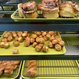 Cinnamon roll, donut holes, and glaze twist donut