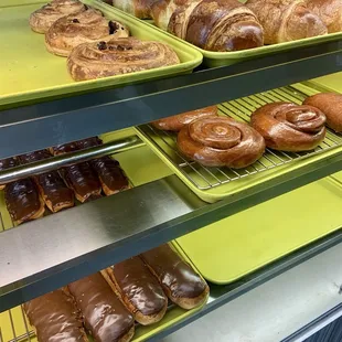 Raisin roll, ham and cheese croissant, chocolate long John donut , and cinnamon bun