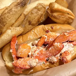 Lobster Roll with hot out of the fryer potato spuds. (*‿*) Always our favorite here @ the neighborhood #JaxFishFry-St. John&apos;s.