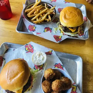 Top: Backyard Barbecue Burger (w/o bacon) and fries Bottom: The Original Jax Burger w/cheese and hush puppies