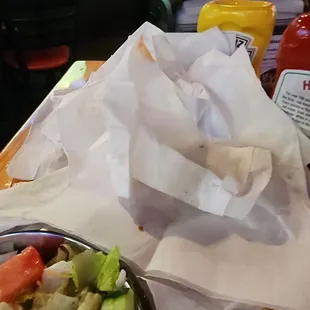 The pile of napkins used to try to get the grease out of 1 piece of the fish.