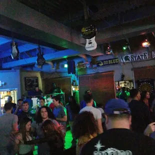 a crowd of people at a bar