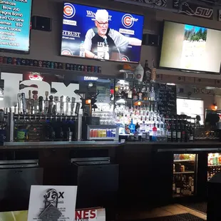 a bar with a large screen tv