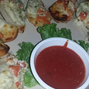 Italian bread with blue cheese crumbs and red sauce. Give it a try.