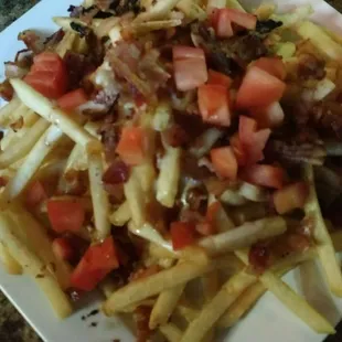 Sharing these loaded fries, which is really good for the price and for any football game.