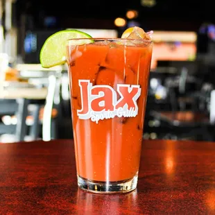 a bloody drink with a lime wedge