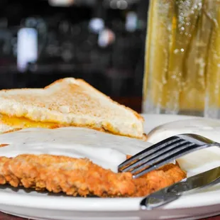 a plate of food and a glass of beer