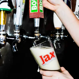 beer being poured into a glass