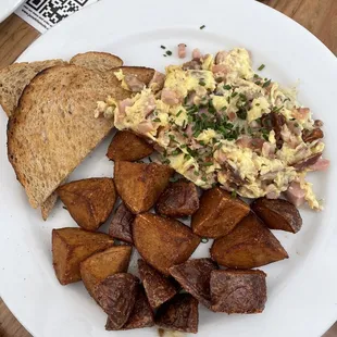 Carnivore scramble with country potatoes and wheat toast