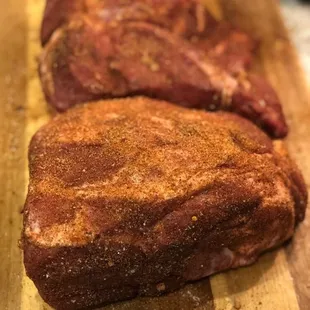 two steaks on a cutting board