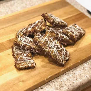 a wooden cutting board with some food on it
