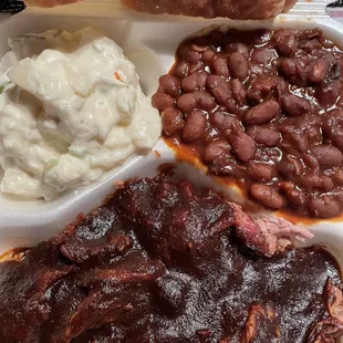Dinner - Small Pork Shoulder plate smothered in Medium sauce with baked beans + potato salad; 2 slices of white bread on the side