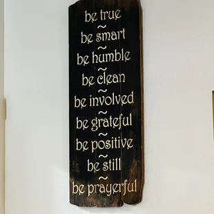 a sign on a wall saying be true be smart be humble be clean be involved be grateful be positive be still be