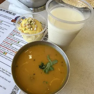 a bowl of soup and a glass of milk