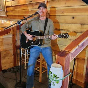 a man playing a guitar