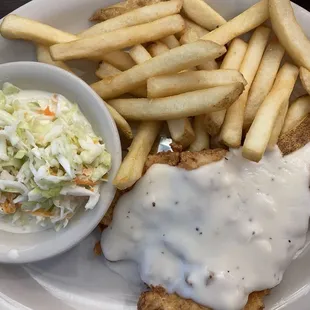 Chicken fried chicken with fries and coleslaw